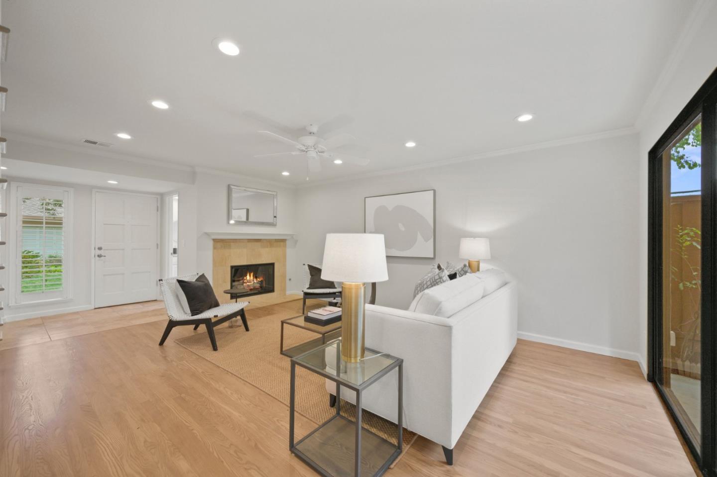 446 Hogarth Terrace Sunnyvale, CA 94087 - Photo 9 of 36 a living room with furniture a fireplace and a table