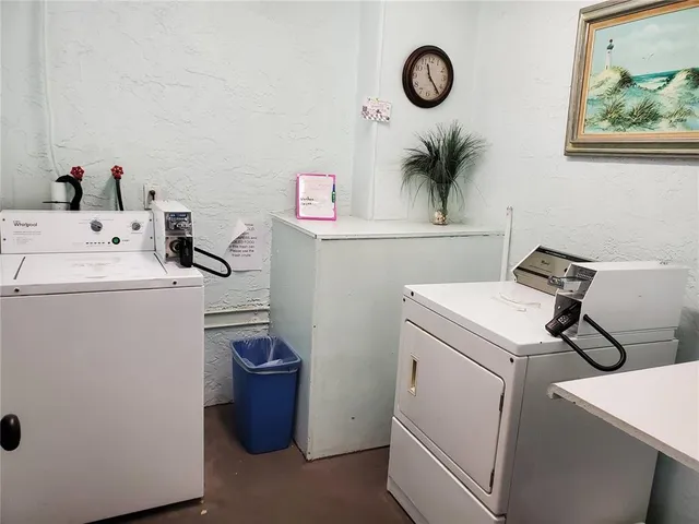 a view of a patio with couches table and chairs and potted plants
