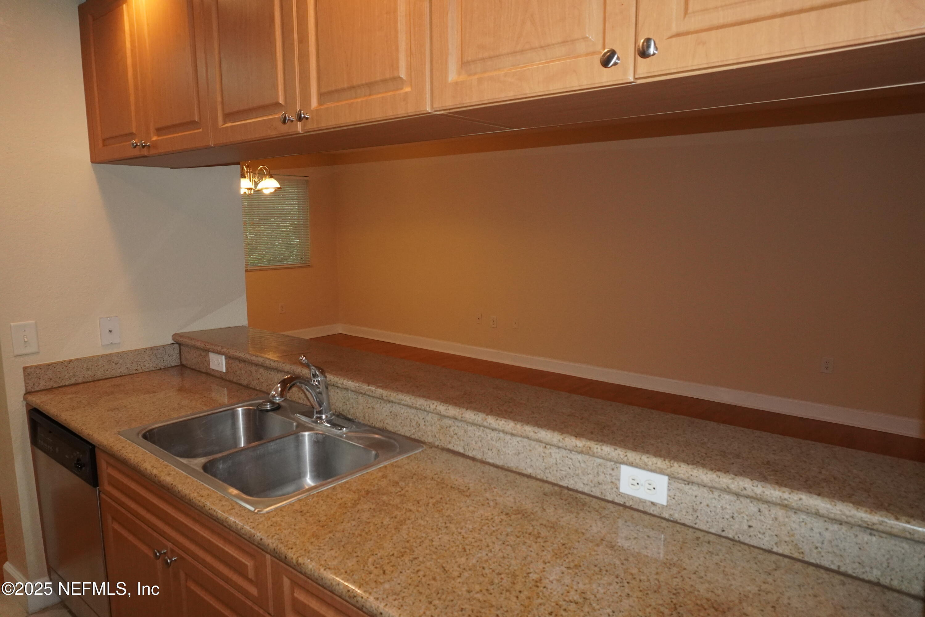 9745 Touchton Road, Unit 2201 Jacksonville, FL 32246 - Photo 13 of 32 a kitchen with a sink and cabinets