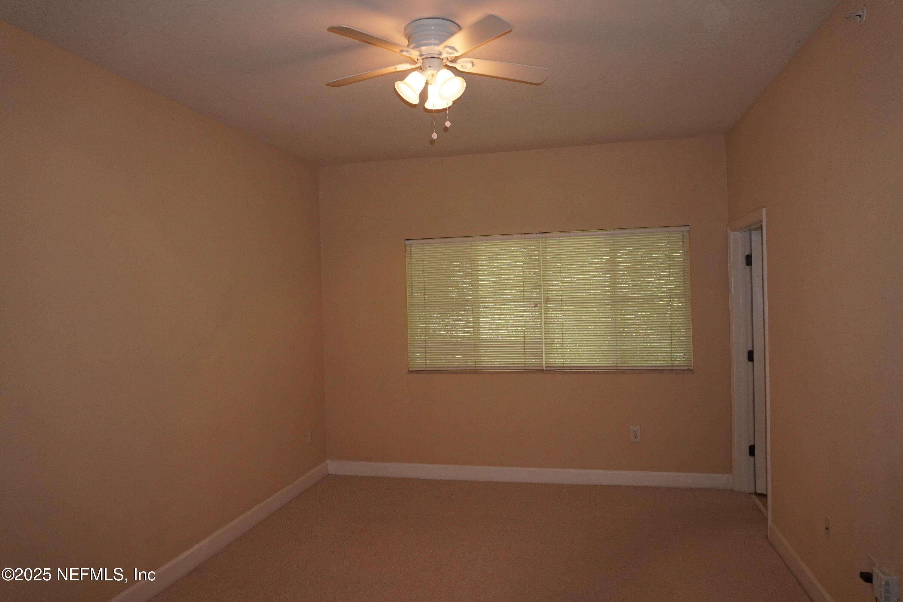 9745 Touchton Road, Unit 2201 Jacksonville, FL 32246 - Photo 17 of 32 an empty room with a window