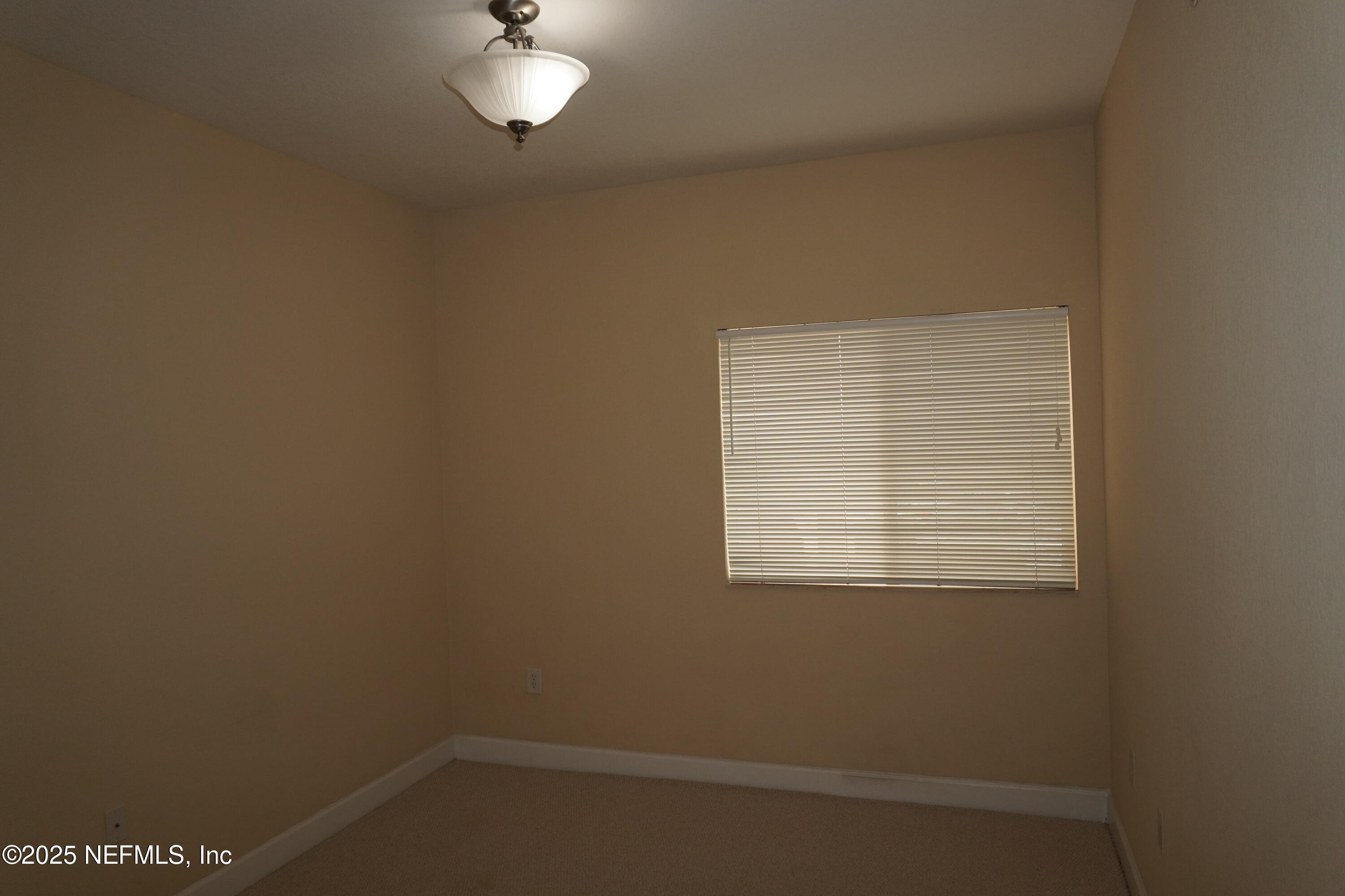 9745 Touchton Road, Unit 2201 Jacksonville, FL 32246 - Photo 22 of 32 an empty room with a window