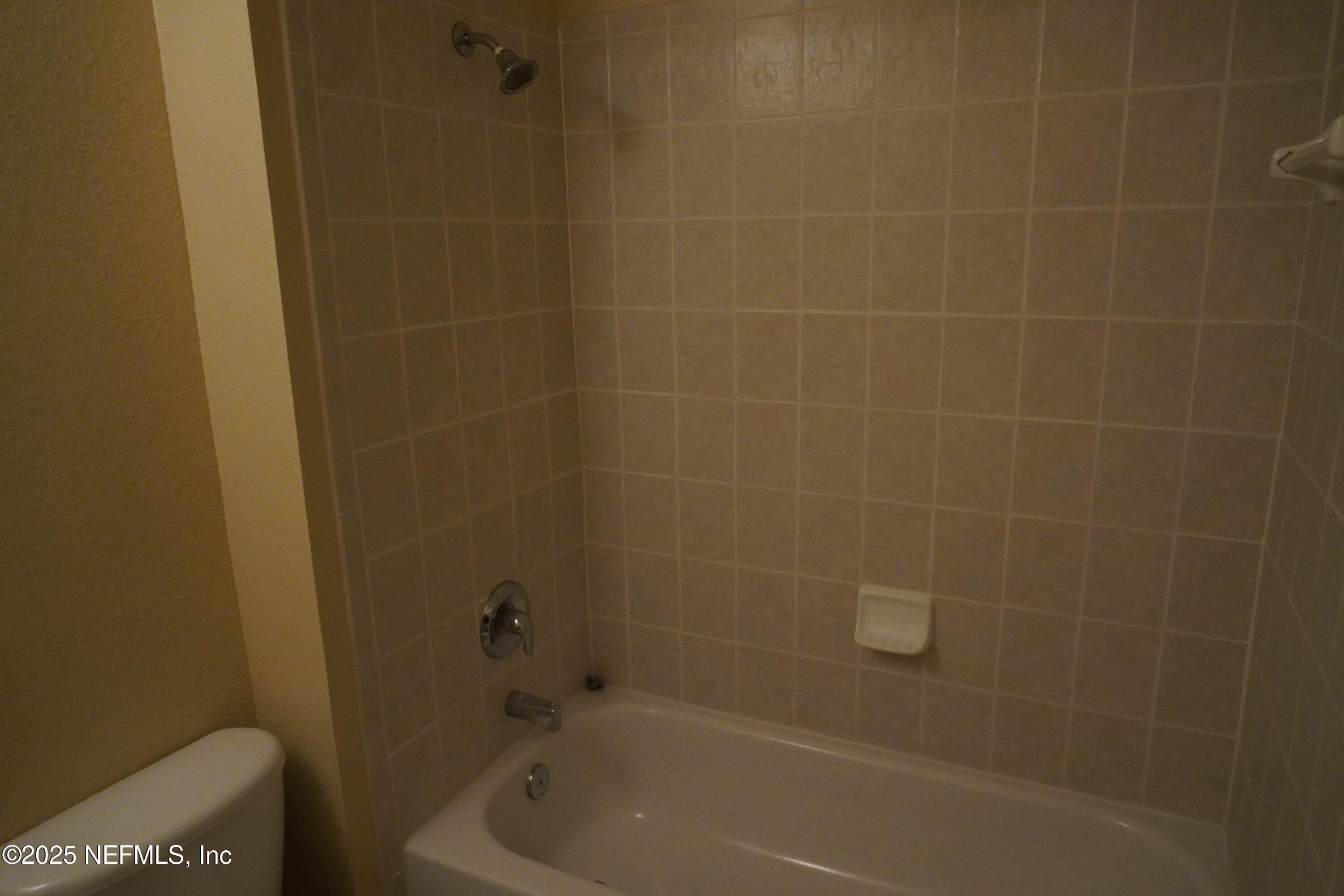 9745 Touchton Road, Unit 2201 Jacksonville, FL 32246 - Photo 24 of 32 a bathroom with a bathtub