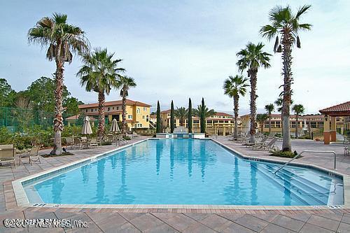 9745 Touchton Road, Unit 2201 Jacksonville, FL 32246 - Photo 28 of 32 a view of a swimming pool with a lawn chairs