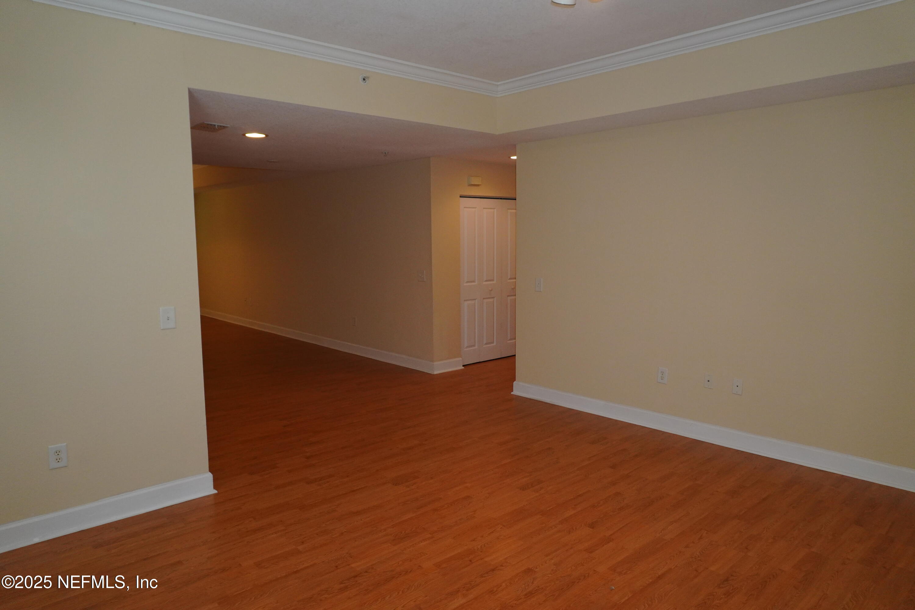 9745 Touchton Road, Unit 2201 Jacksonville, FL 32246 - Photo 2 of 32 an empty room with wooden floor and windows