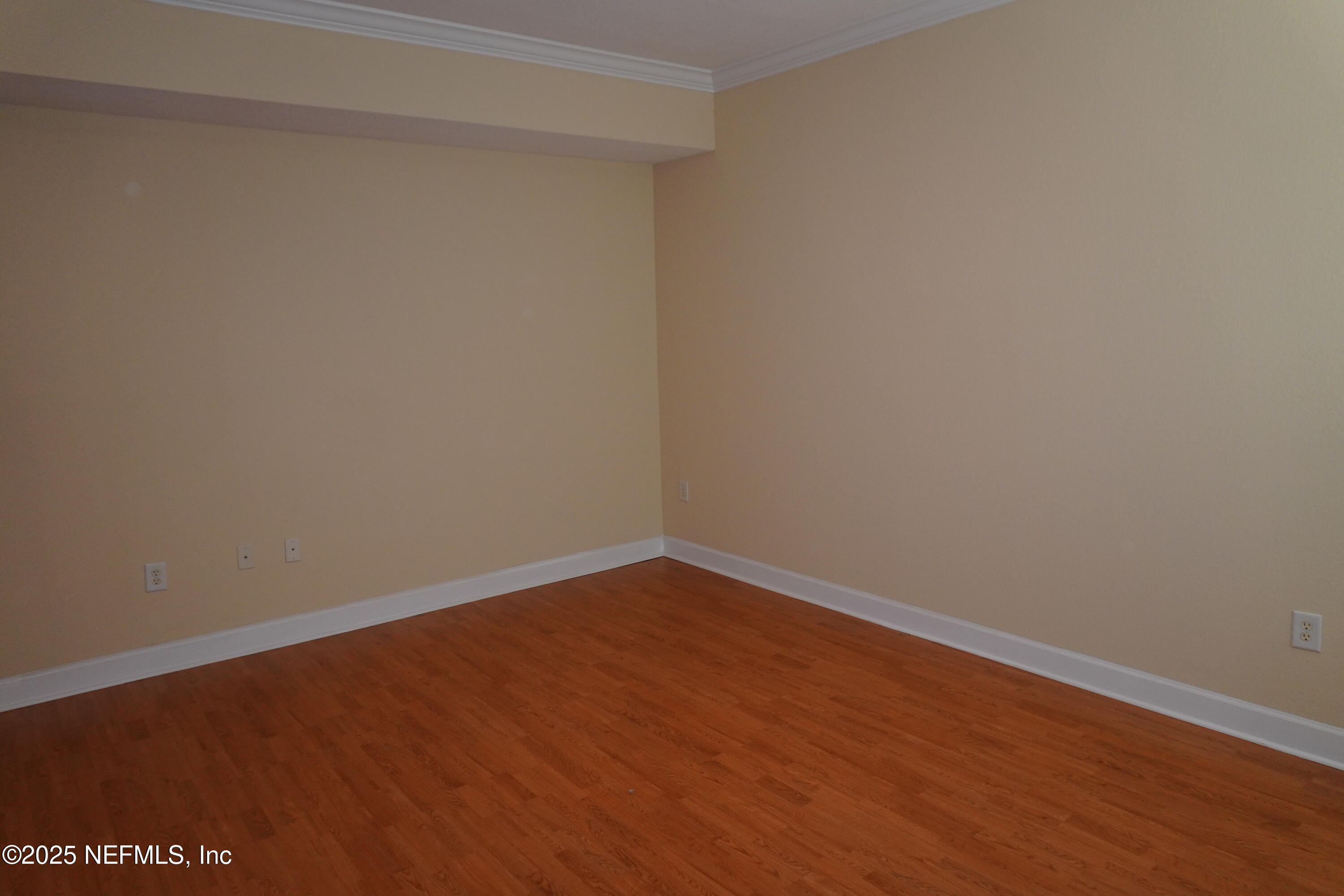 9745 Touchton Road, Unit 2201 Jacksonville, FL 32246 - Photo 3 of 32 a view of an empty room with wooden floor