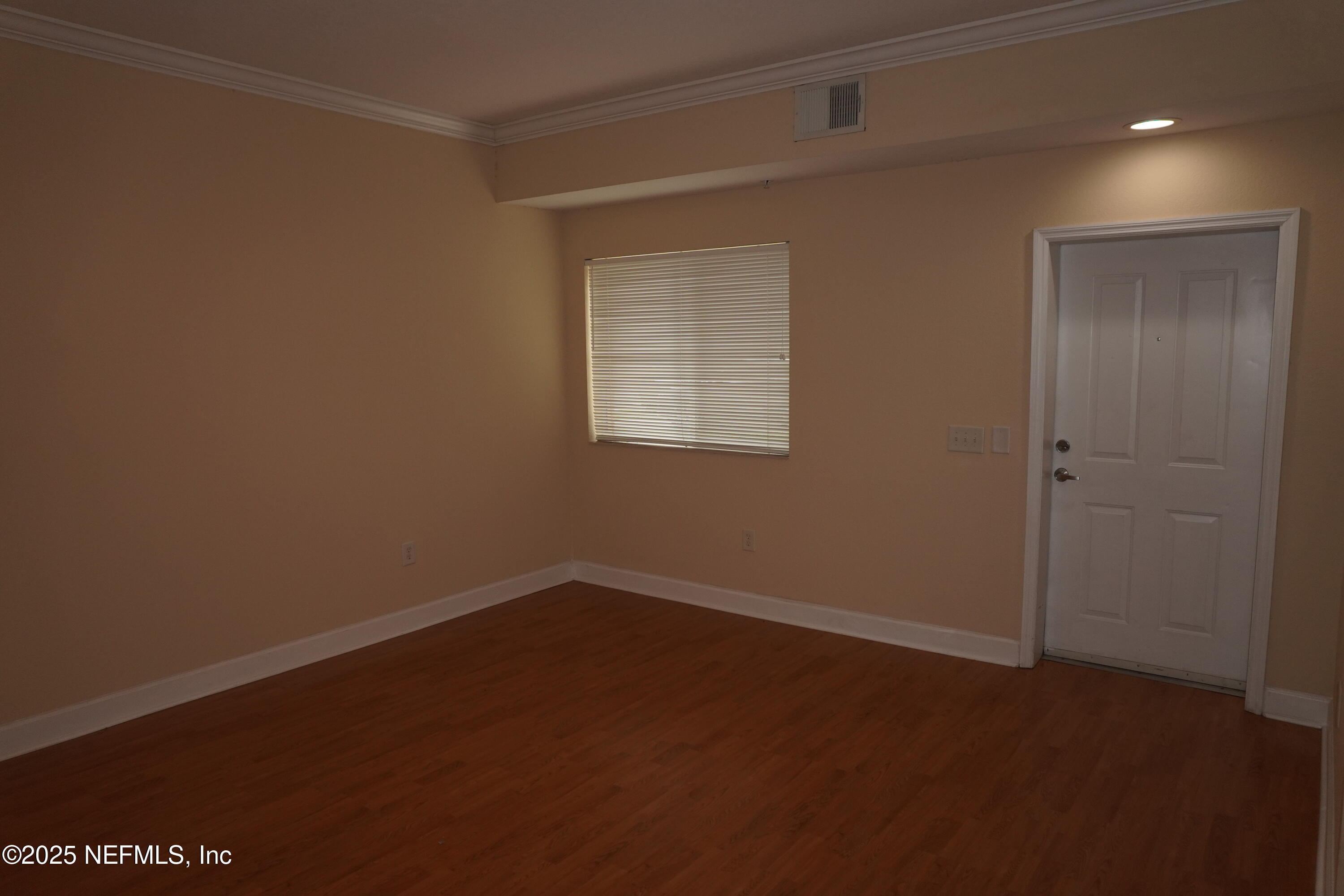9745 Touchton Road, Unit 2201 Jacksonville, FL 32246 - Photo 5 of 32 an empty room with a window