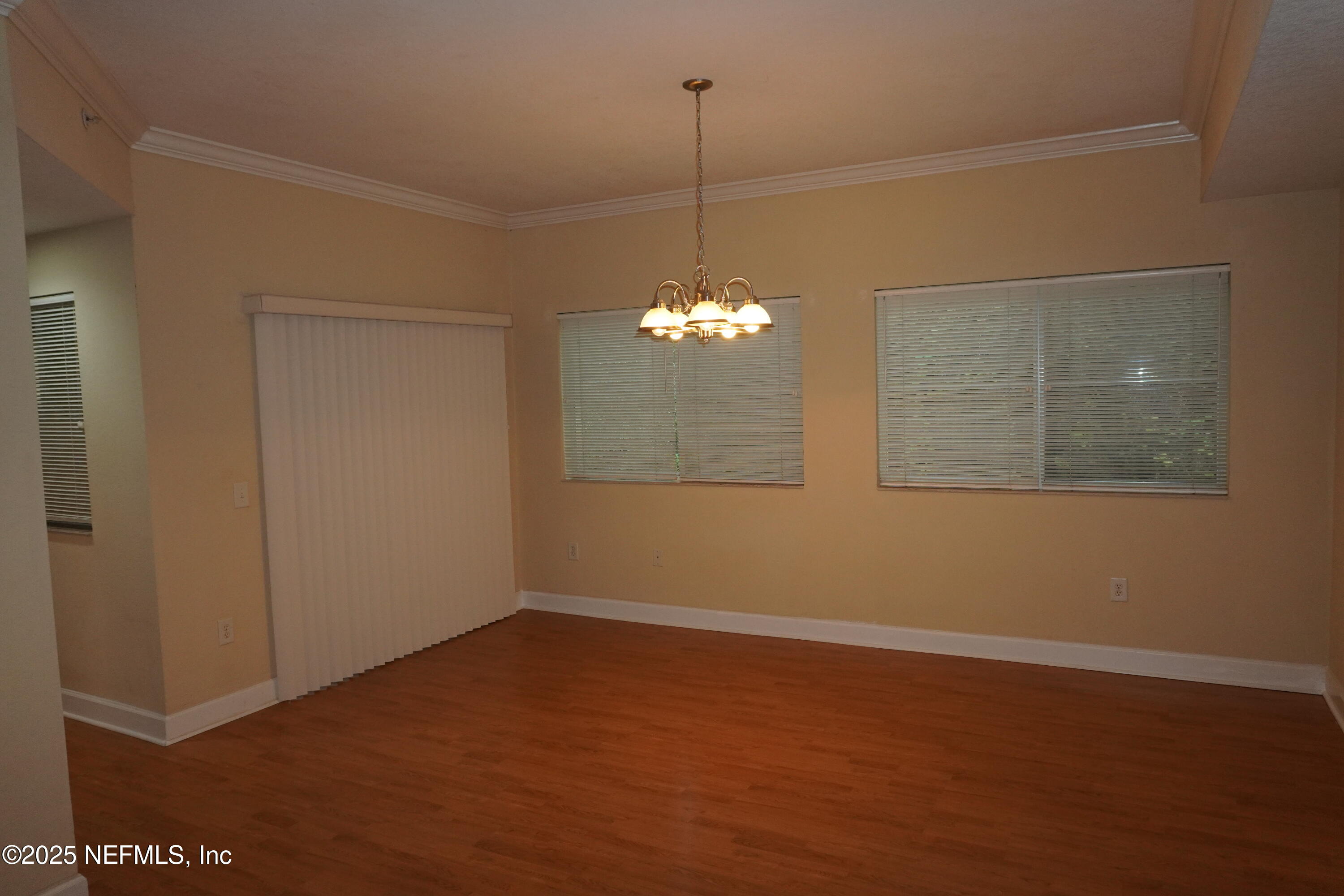 9745 Touchton Road, Unit 2201 Jacksonville, FL 32246 - Photo 7 of 32 a view of a room with window and wooden floor