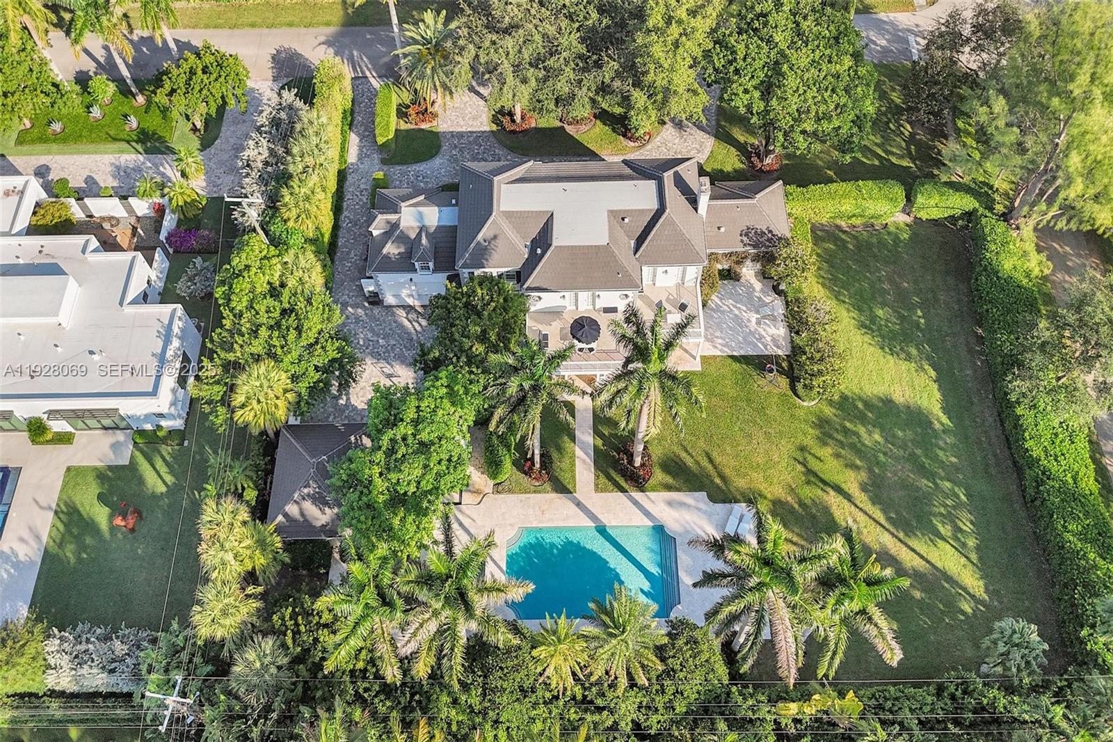 1281 Banyan Road Boca Raton, FL 33432 - Photo 65 of 69 an aerial view of residential house with outdoor space and trees all around