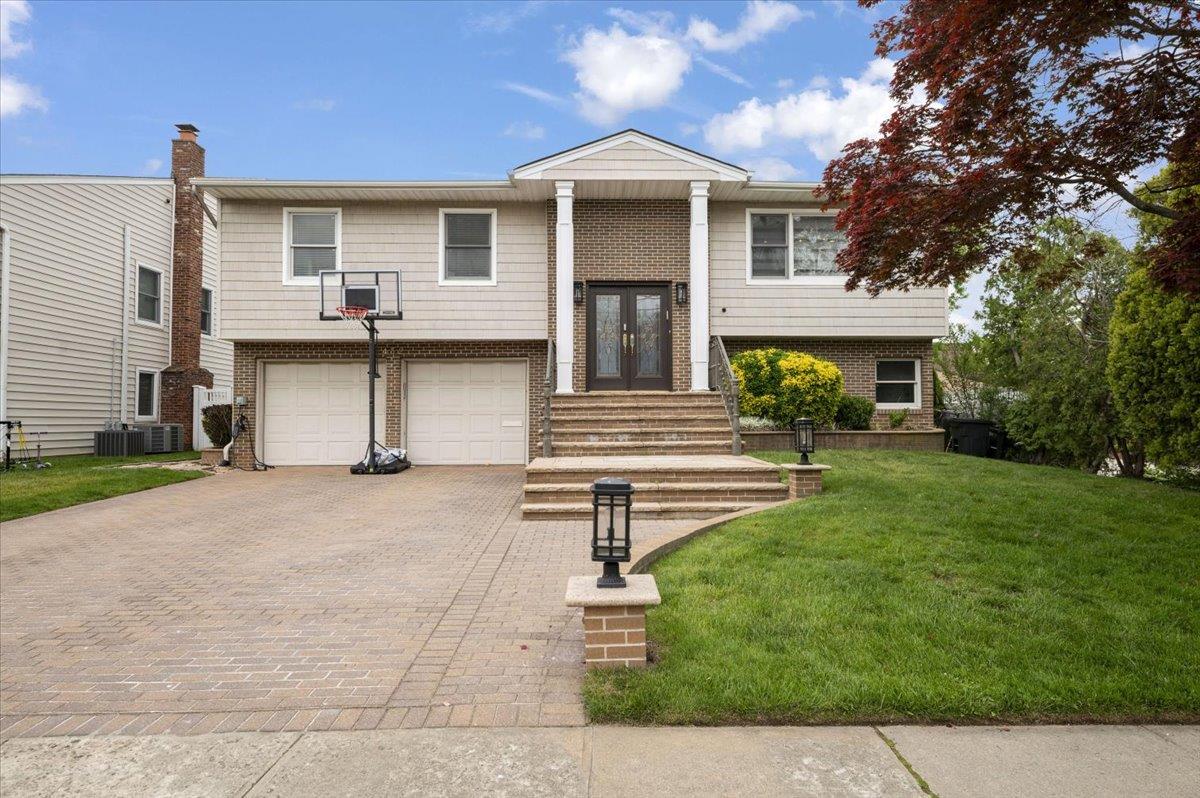 a front view of a house with a yard