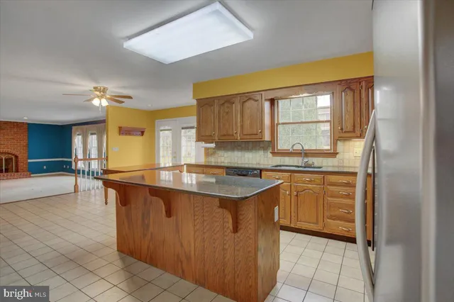 a view of living room kitchen and entryway