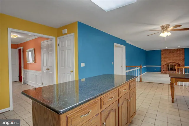 a kitchen with stainless steel appliances granite countertop a stove a sink dishwasher and a refrigerator