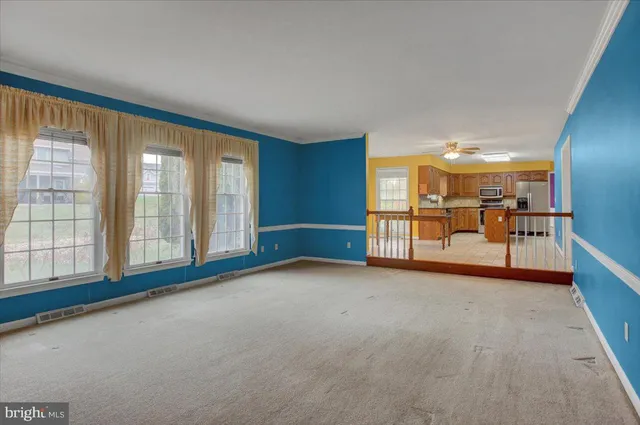 a bathroom with a granite countertop toilet sink and mirror