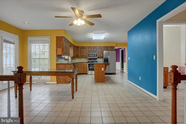 a bathroom with a sink a toilet and a shower