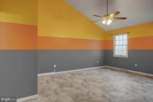 a bathroom with a toilet a sink and a window