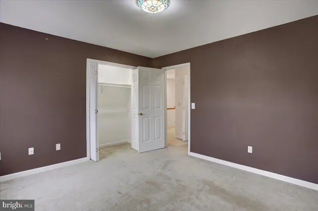 a view of a house with a bench