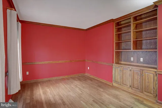 a living room with furniture flat screen tv and rug