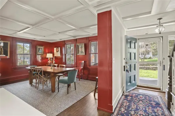 a view of a dining room with furniture window and wooden floor