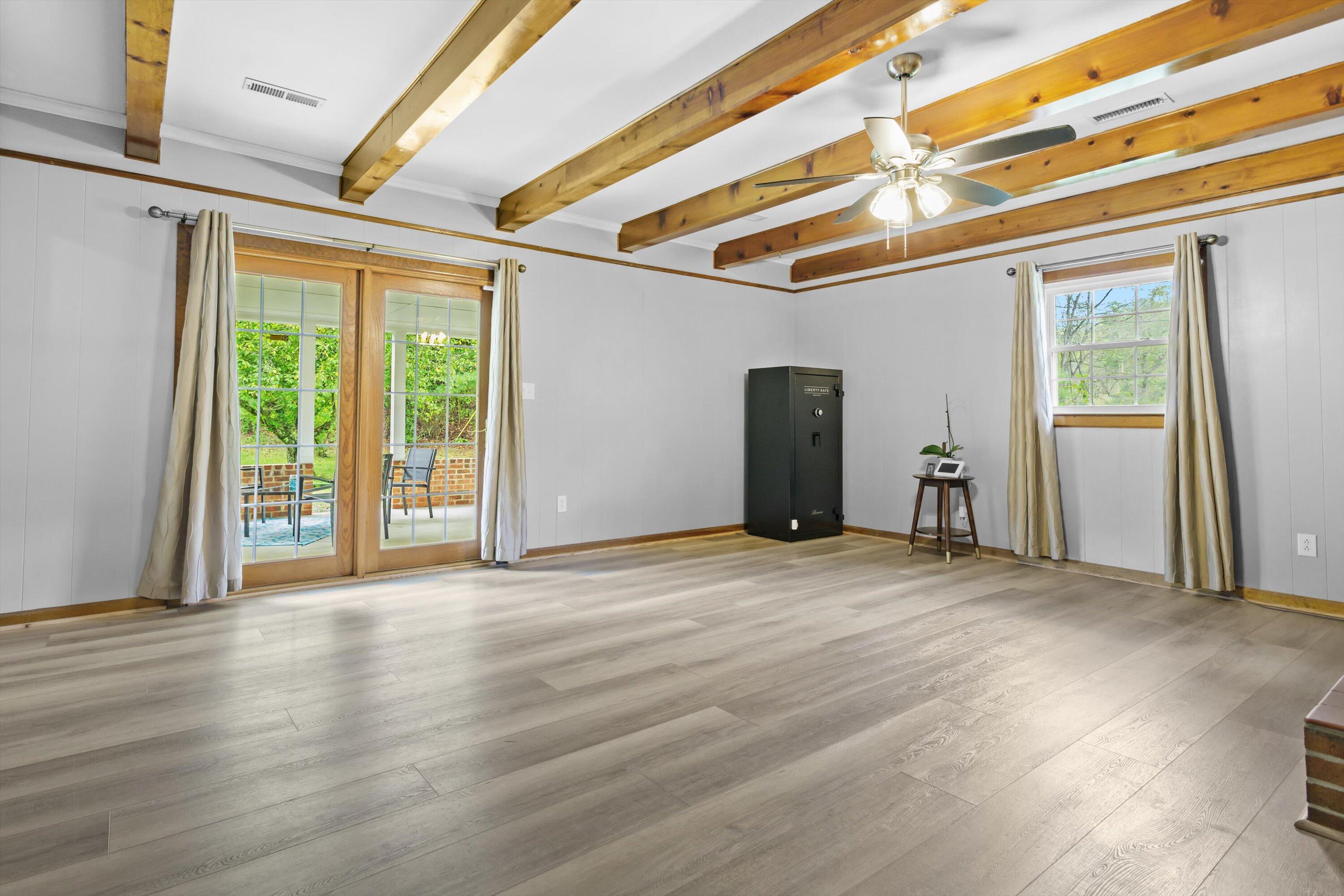 2560 Fishers View Road Shawsville, VA 24162 - Photo 11 of 30 a view of an empty room with wooden floor and a window