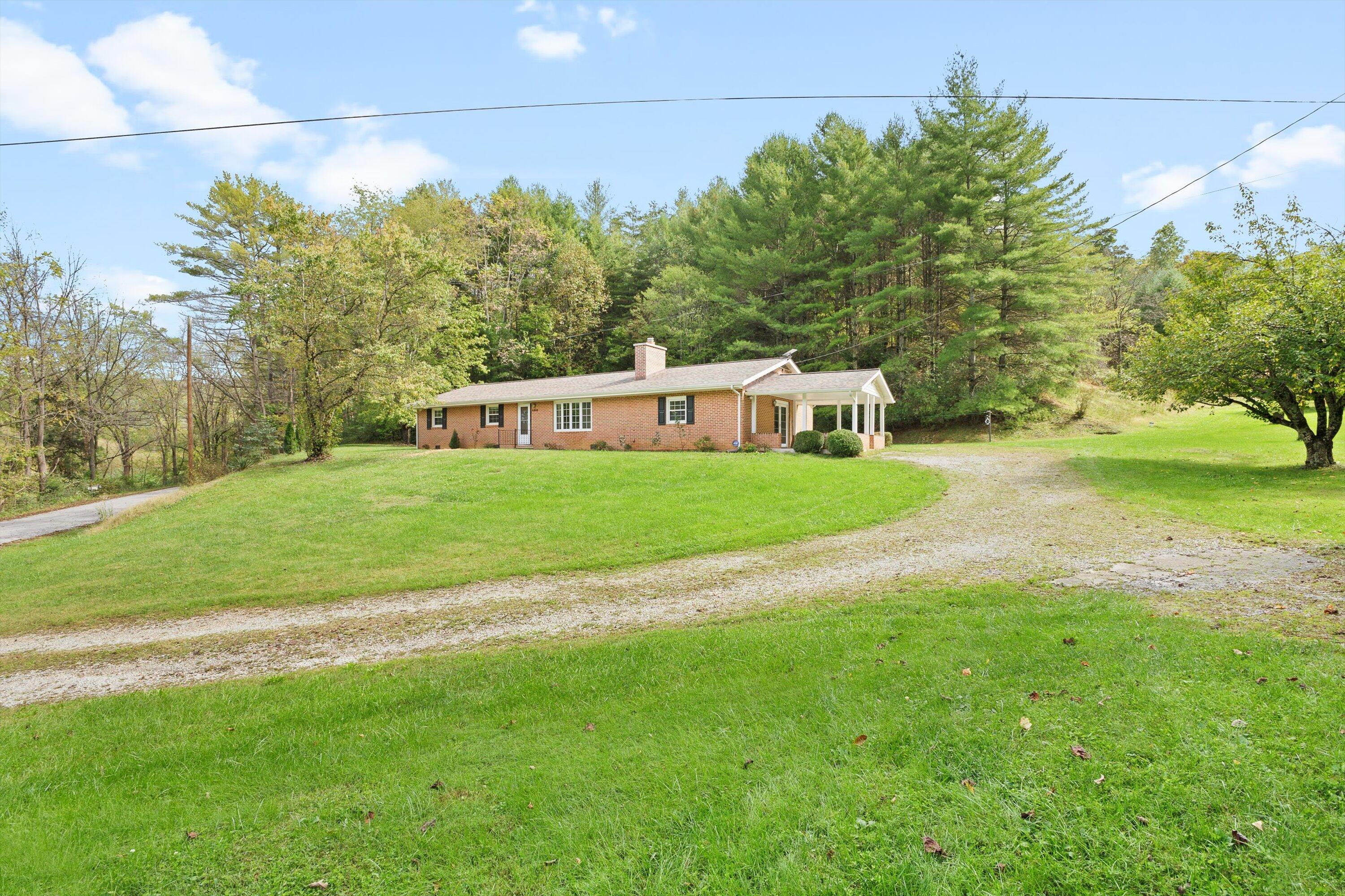 2560 Fishers View Road Shawsville, VA 24162 - Photo 2 of 30 a view of a house with a yard