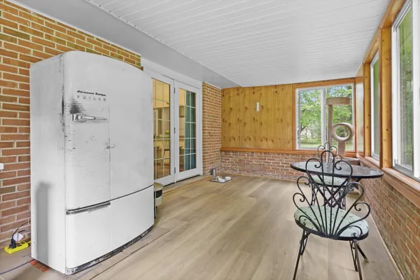 a view of a livingroom with furniture window and outside view