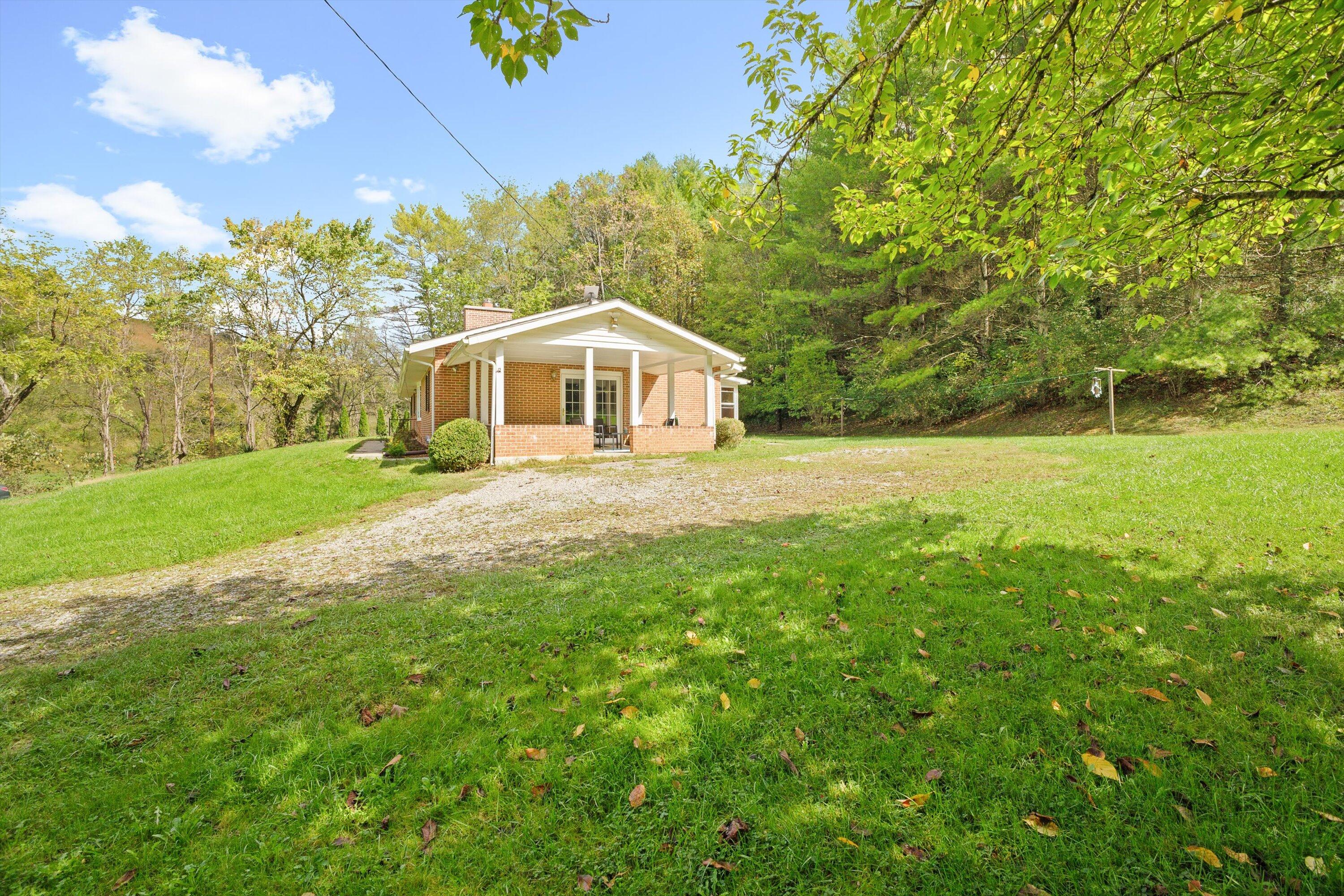 2560 Fishers View Road Shawsville, VA 24162 - Photo 26 of 30 a front view of a house with yard and green space