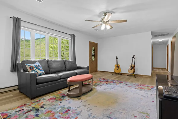 a living room with furniture and a window