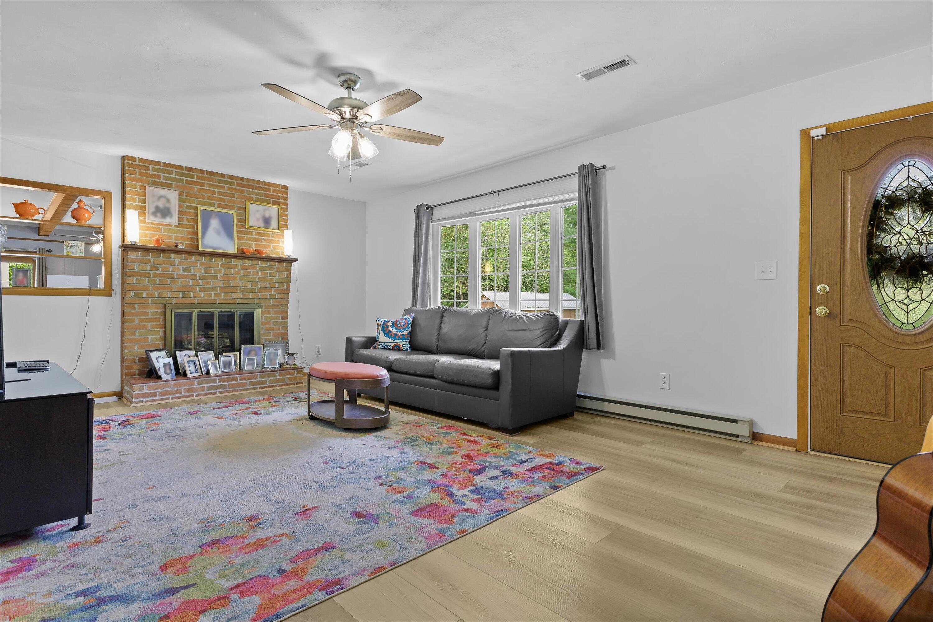 2560 Fishers View Road Shawsville, VA 24162 - Photo 5 of 30 a living room with furniture and a fireplace