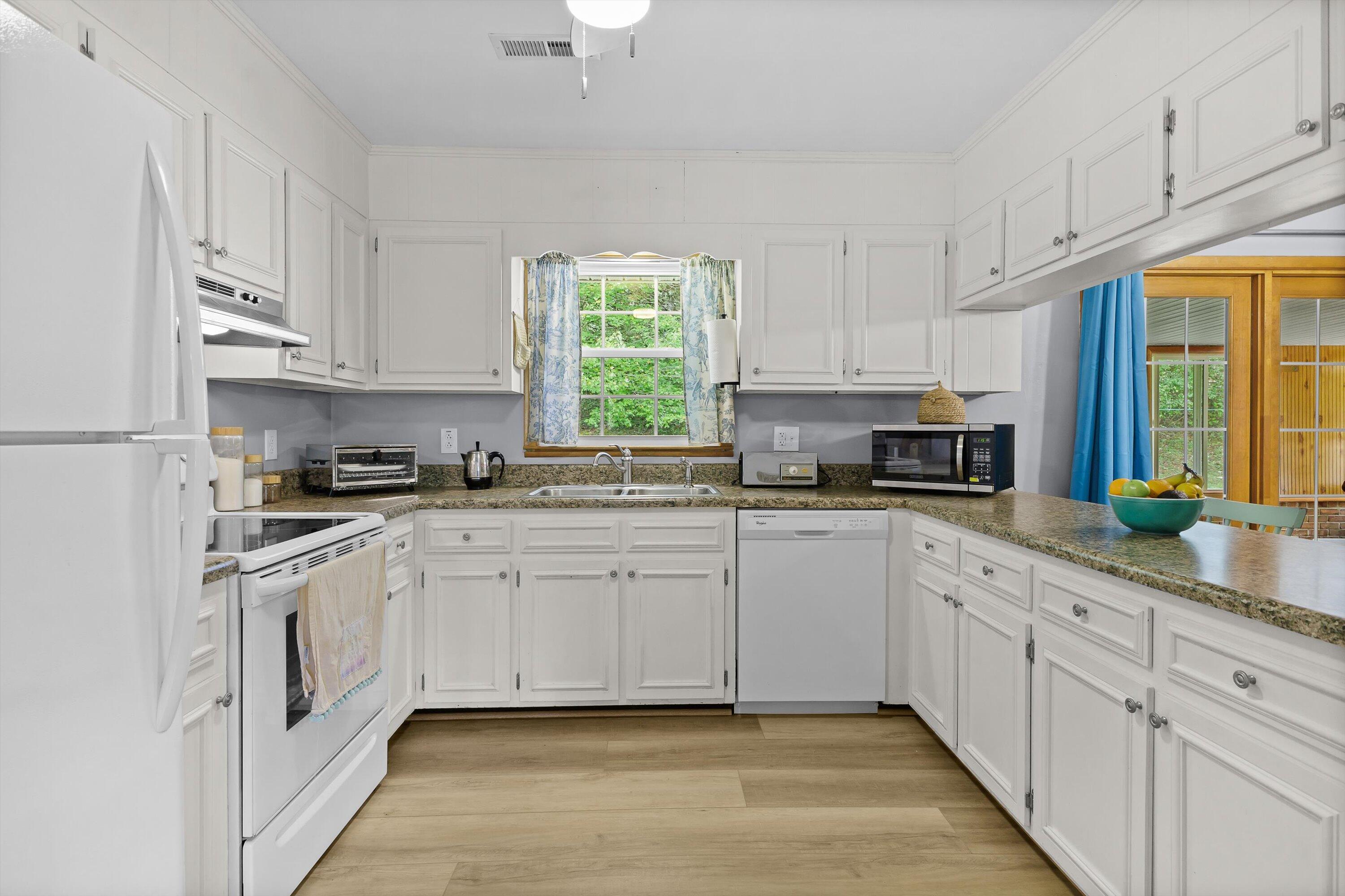 2560 Fishers View Road Shawsville, VA 24162 - Photo 6 of 30 a kitchen with cabinets appliances a sink and a window