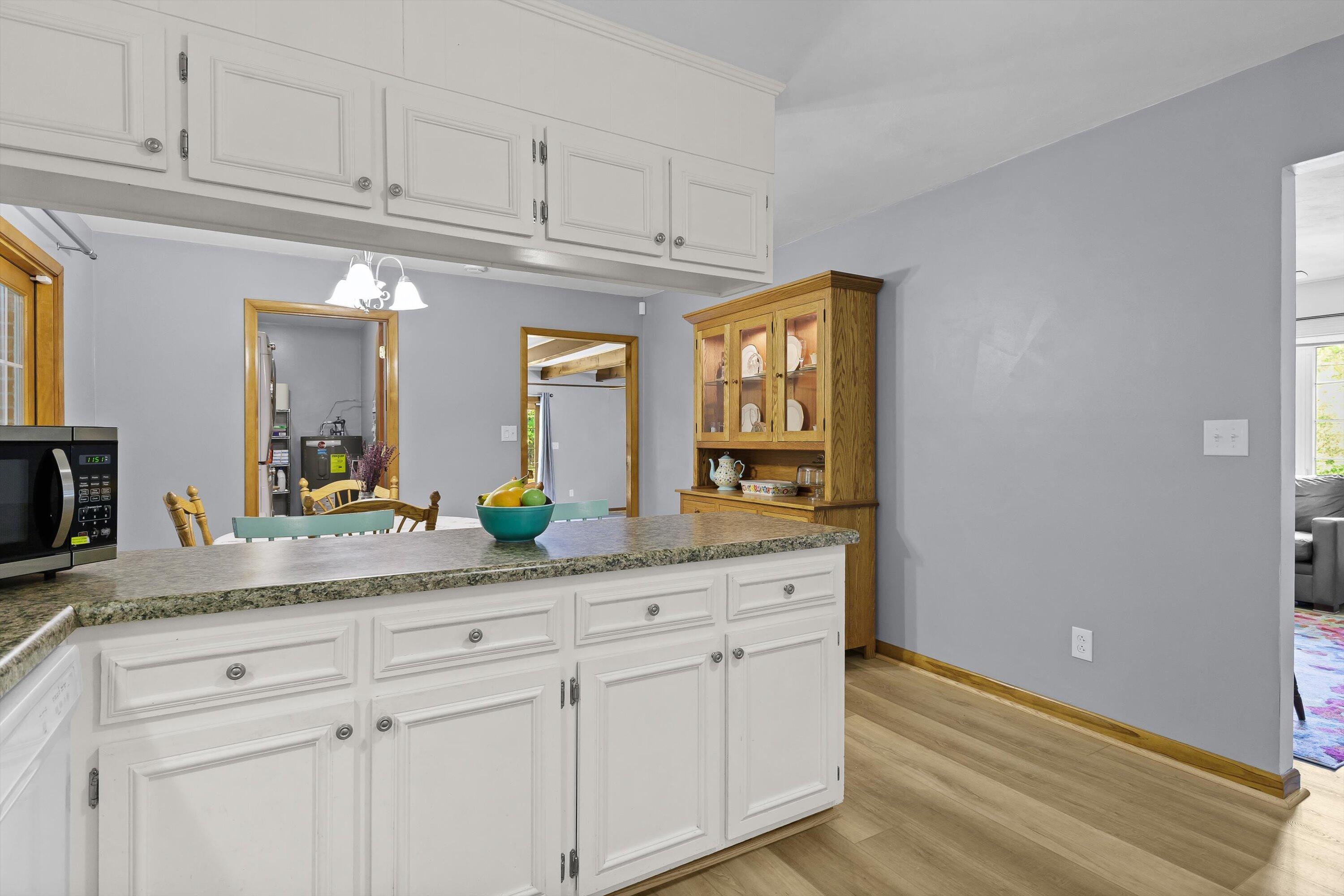 2560 Fishers View Road Shawsville, VA 24162 - Photo 7 of 30 a bathroom with a granite countertop double vanity sink and dishwasher