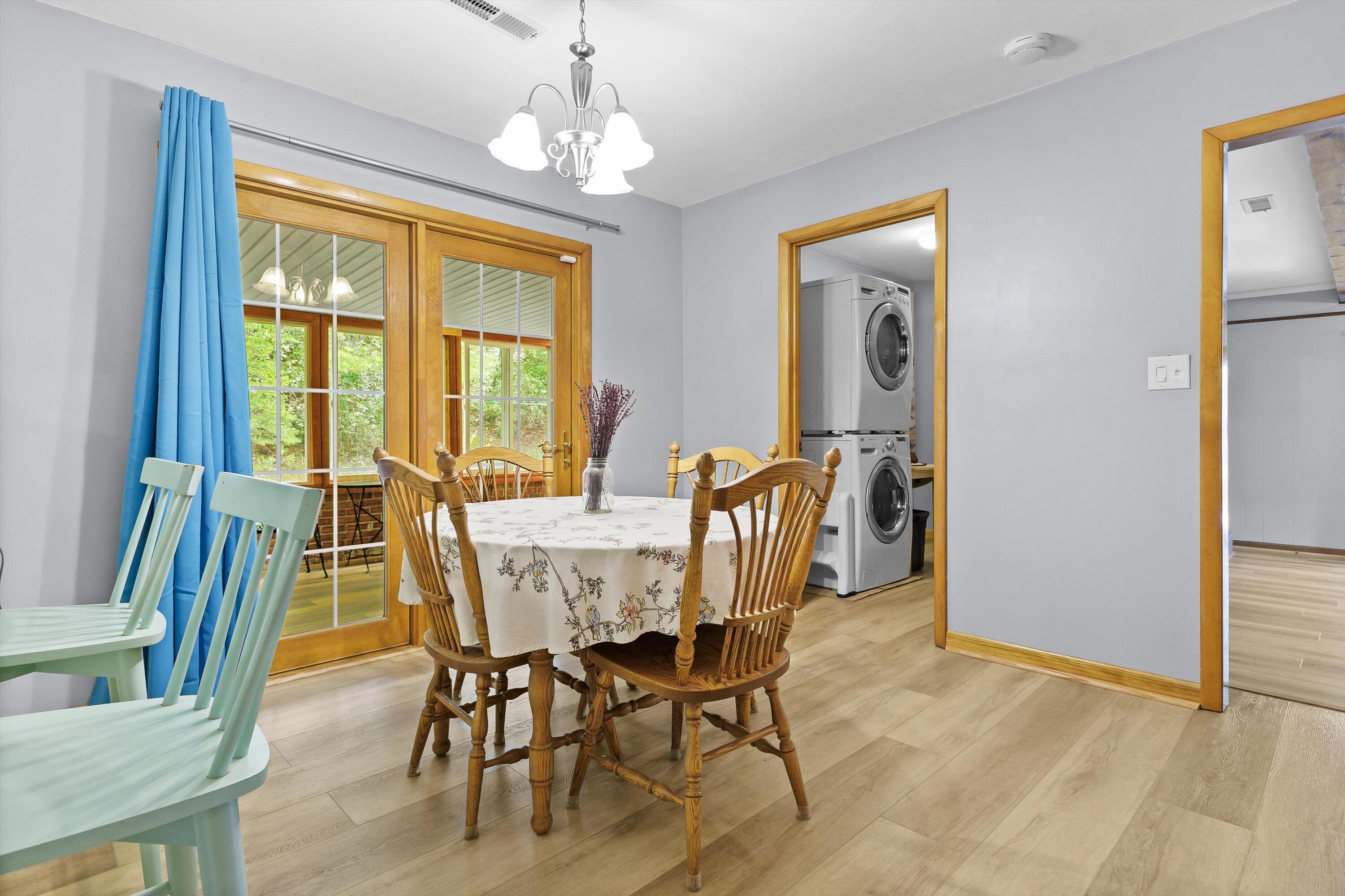 2560 Fishers View Road Shawsville, VA 24162 - Photo 9 of 30 a view of a dining room with furniture wooden floor and chandelier