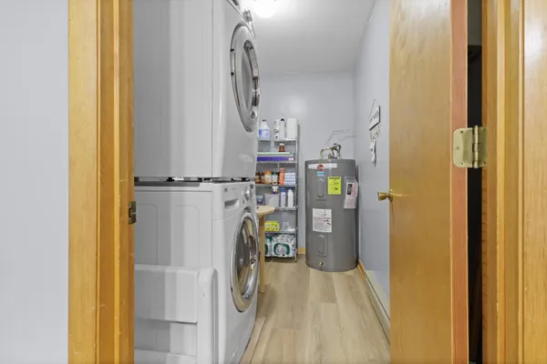 a view of a hallway with wooden shelves