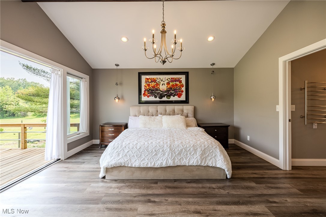 6268 Summers Road Windsor, OH 44099 - Photo 29 of 49 Bedroom with vaulted ceiling, a chandelier, wood finished floors, radiator heating unit, and recessed lighting