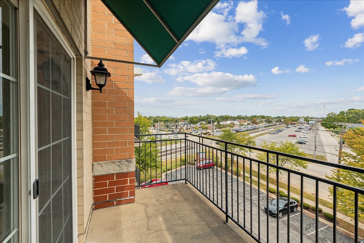 19806 Wolf Road, Unit 405 Mokena, IL 60448 - Photo 11 of 14 a view of balcony with furniture