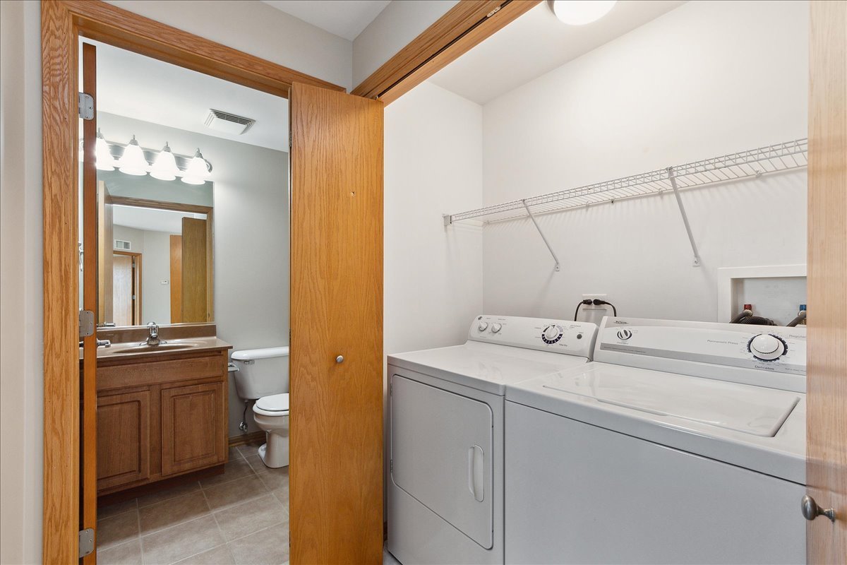 19806 Wolf Road, Unit 405 Mokena, IL 60448 - Photo 10 of 14 a bathroom with a sink and a mirror