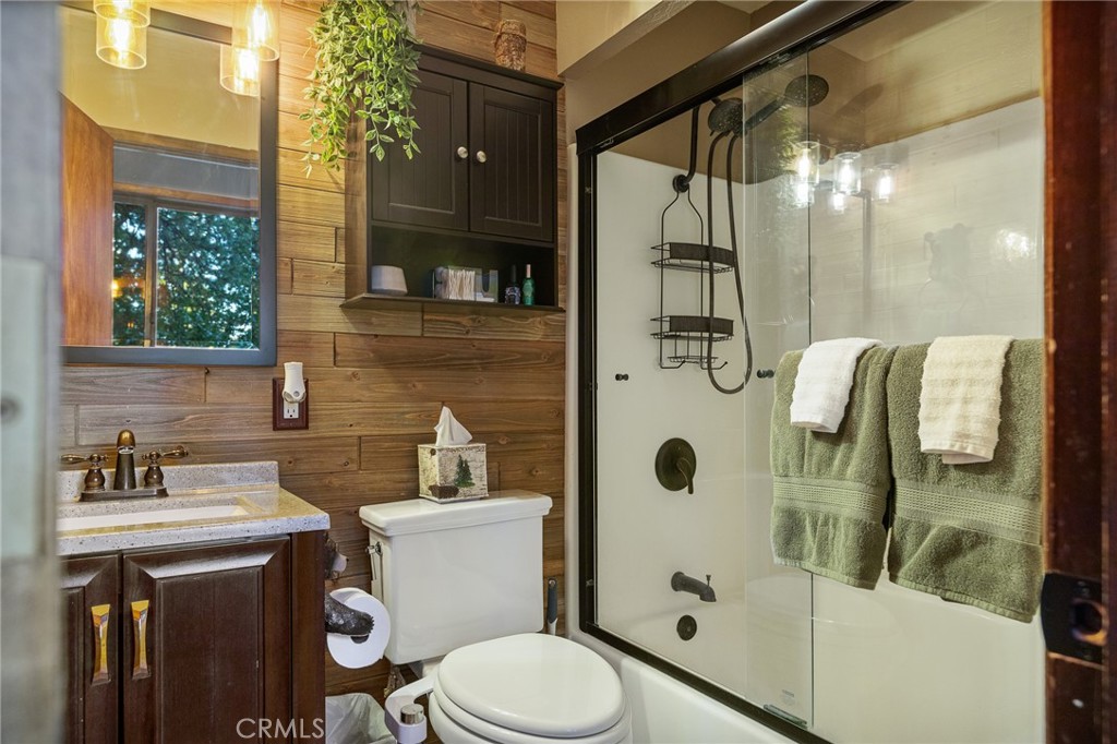31353 Lightfoot Way Running Springs, CA 92382 - Photo 25 of 42 a bathroom with a sink toilet and shower