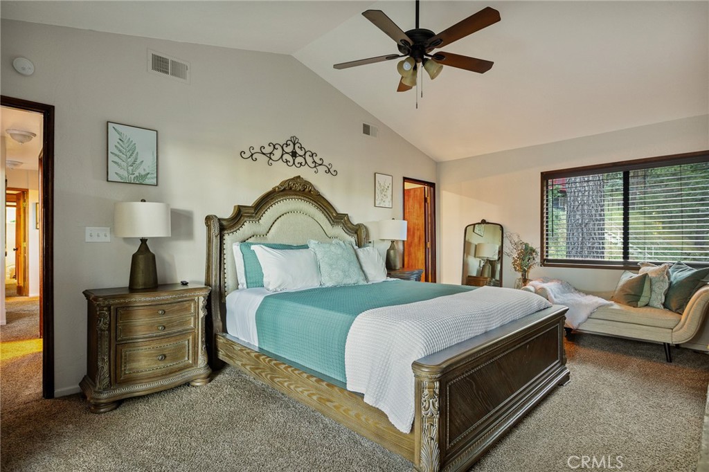 31353 Lightfoot Way Running Springs, CA 92382 - Photo 27 of 42 a bedroom with a bed a couch and dresser