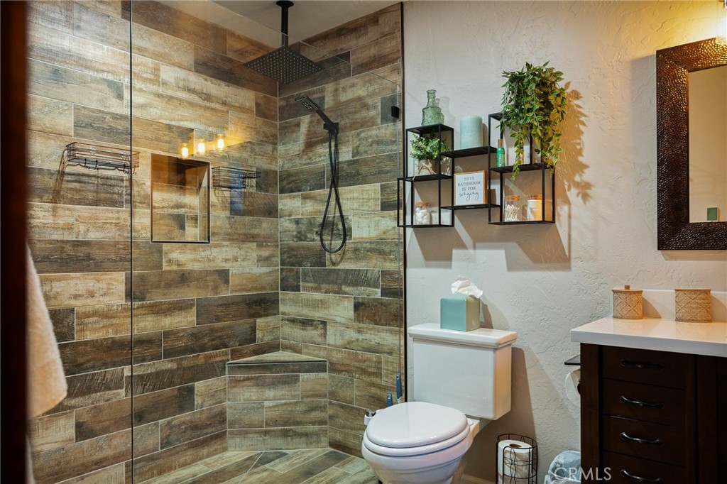 31353 Lightfoot Way Running Springs, CA 92382 - Photo 28 of 42 a bathroom with a toilet and shower