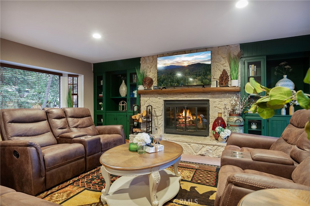 31353 Lightfoot Way Running Springs, CA 92382 - Photo 3 of 42 a living room with furniture a window and a fireplace