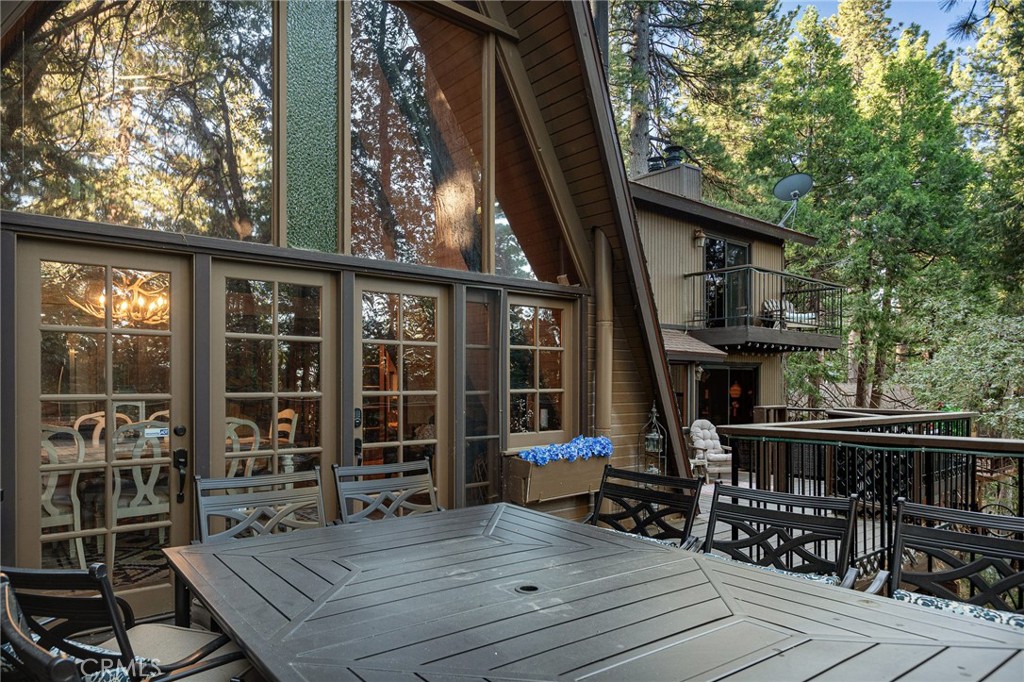 31353 Lightfoot Way Running Springs, CA 92382 - Photo 33 of 42 a view of house with deck outdoor seating and covered with trees