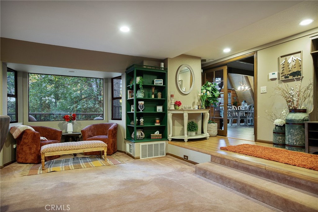 31353 Lightfoot Way Running Springs, CA 92382 - Photo 5 of 42 a living room with furniture and a large window