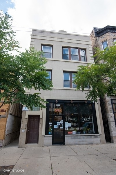 912 North Ashland Avenue, Unit 3C Chicago, IL 60622 - Photo 1 of 7 a front view of a house with garage