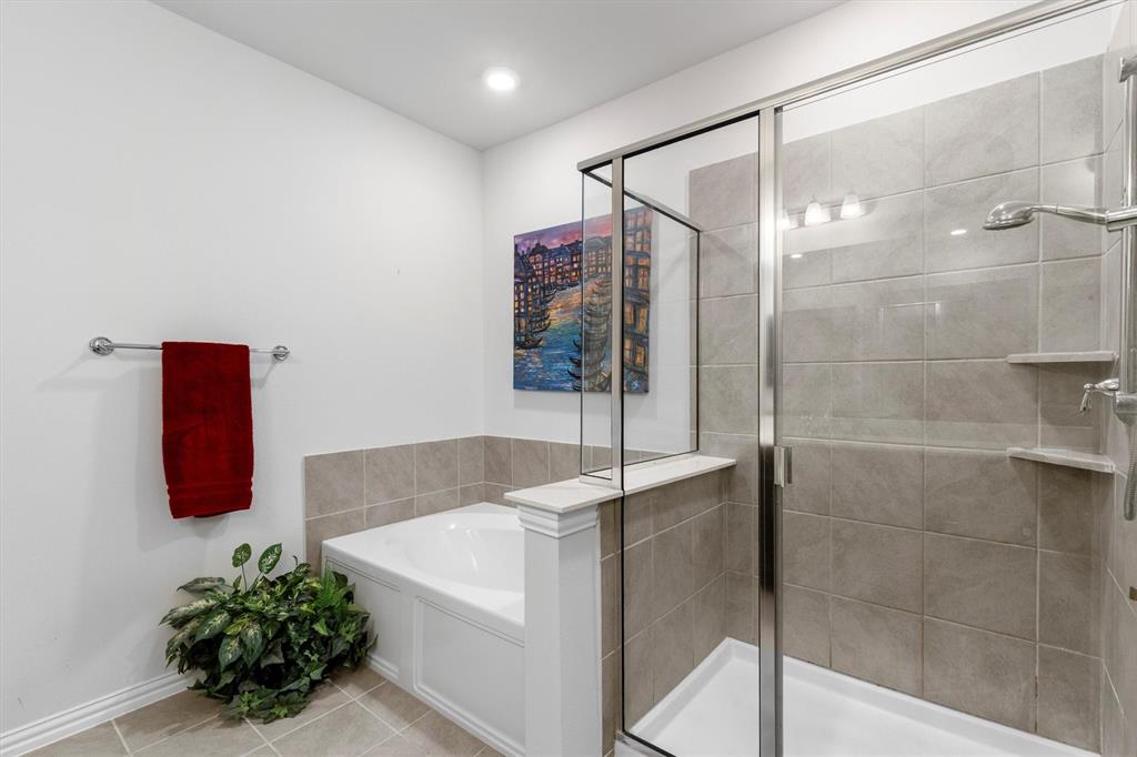651 Watters Road, Unit 5205 Allen, TX 75013 - Photo 15 of 31 a bathroom with a tub shower and sink