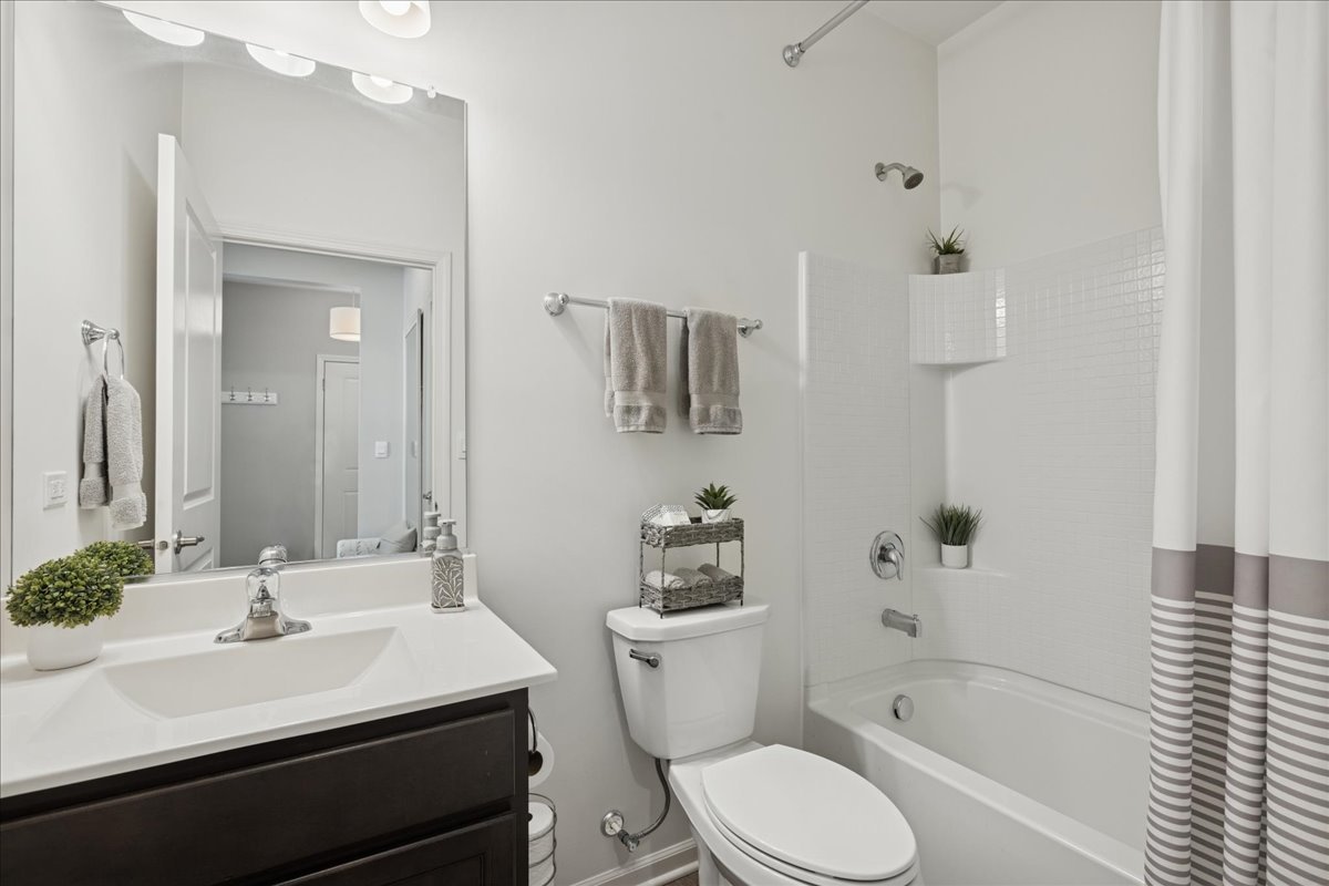 1639 Rochester Road Pingree Grove, IL 60140 - Photo 16 of 21 a bathroom with a sink toilet tub and shower