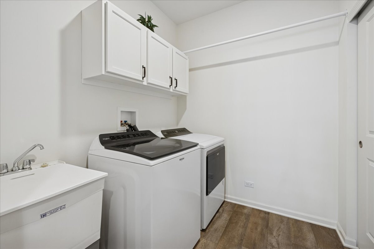 1639 Rochester Road Pingree Grove, IL 60140 - Photo 18 of 21 a view of a storage and utility room with wooden floor