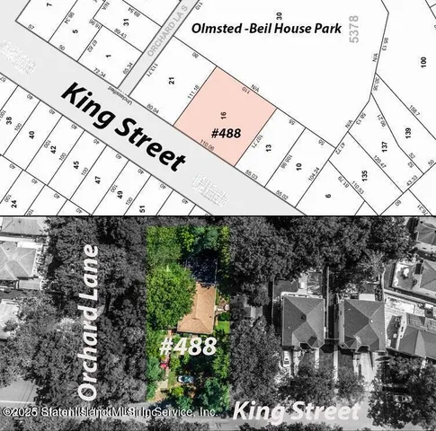 an aerial view of residential house with outdoor space and trees all around