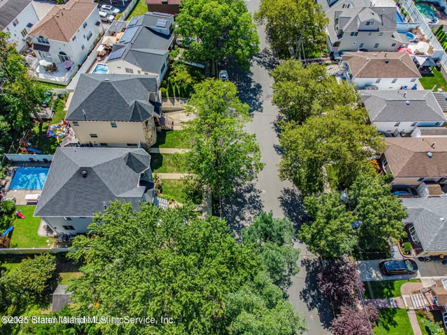 a view of a house with a yard and sitting space