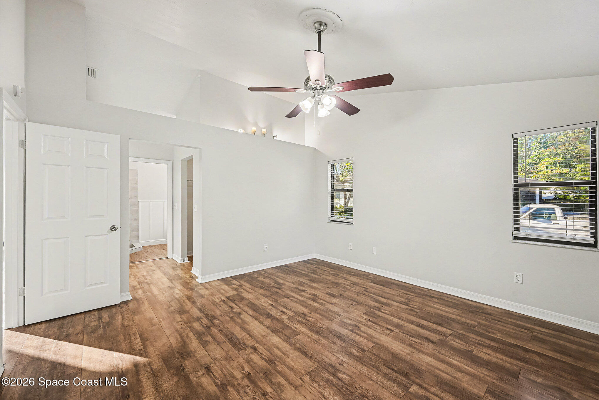 110 Cardinal Drive Sebastian, FL 32958 - Photo 12 of 23 a view of empty room with wooden floor and fan