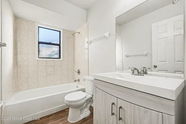 a bathroom with a sink a toilet and a bathtub
