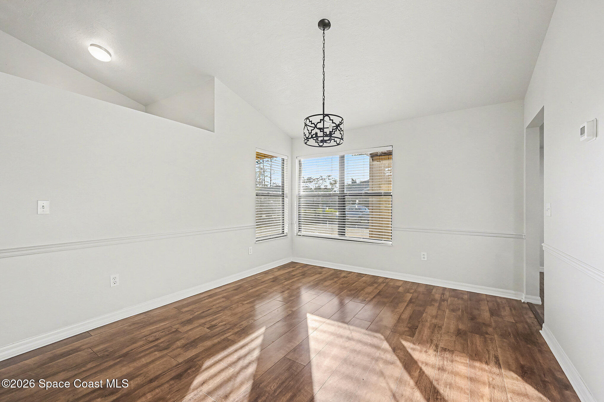 110 Cardinal Drive Sebastian, FL 32958 - Photo 4 of 23 a view of big room with windows