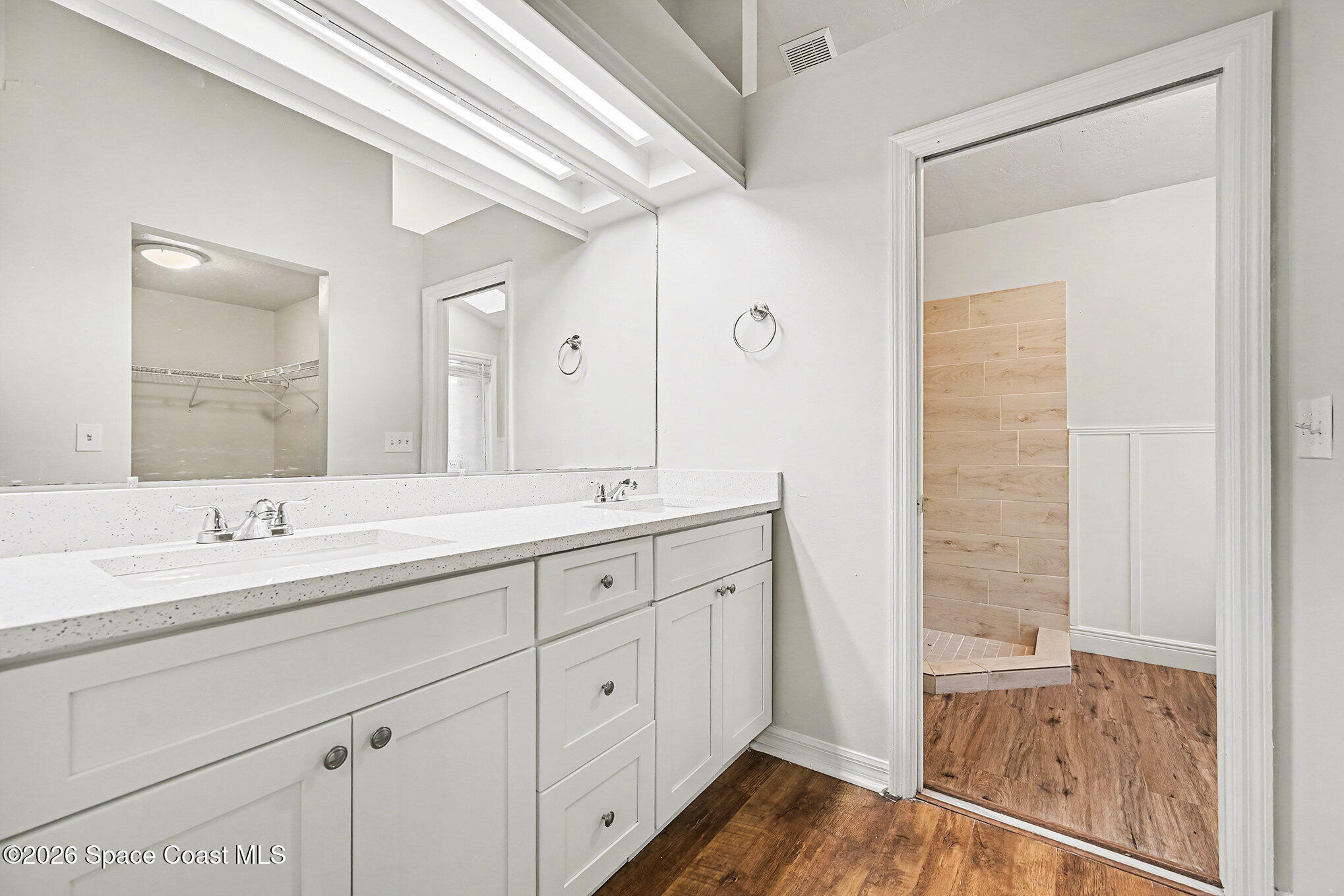 110 Cardinal Drive Sebastian, FL 32958 - Photo 8 of 23 a bathroom with a double vanity sink and a mirror